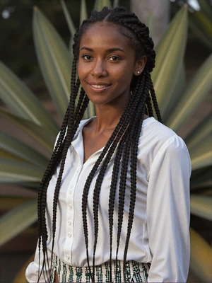 Beautiful Grenadian woman with warm Caribbean features and welcoming smile